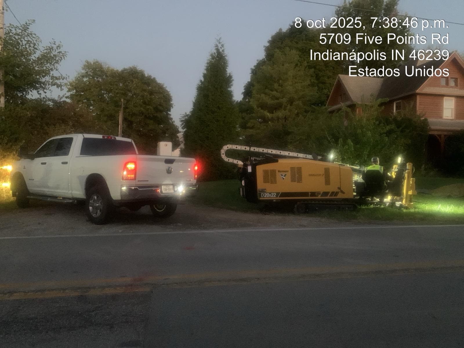 Operator running a Vermeer D20x22 directional drill under work lights at dusk