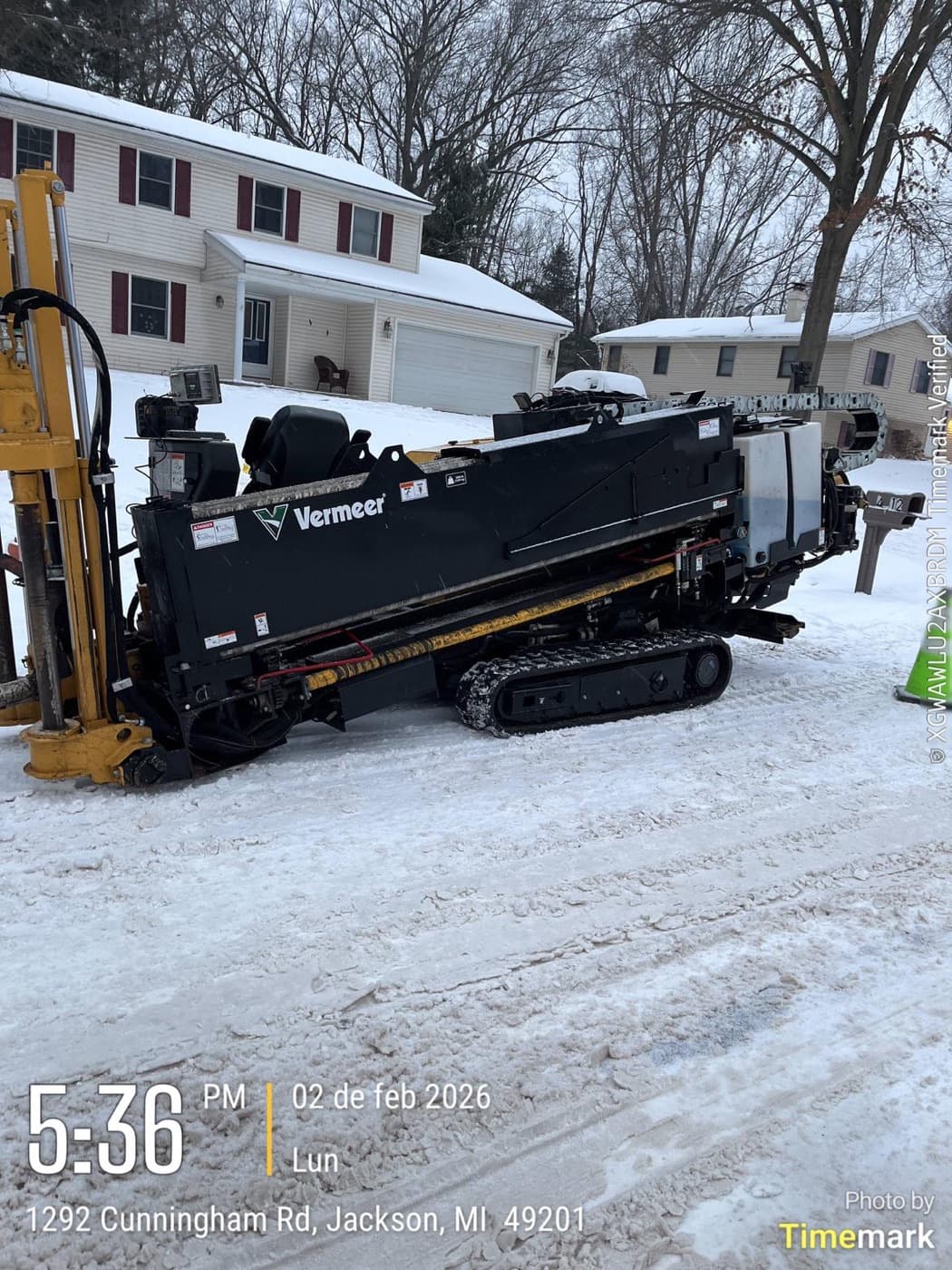 INCORED equipment working a snow-covered residential street in Jackson, Michigan